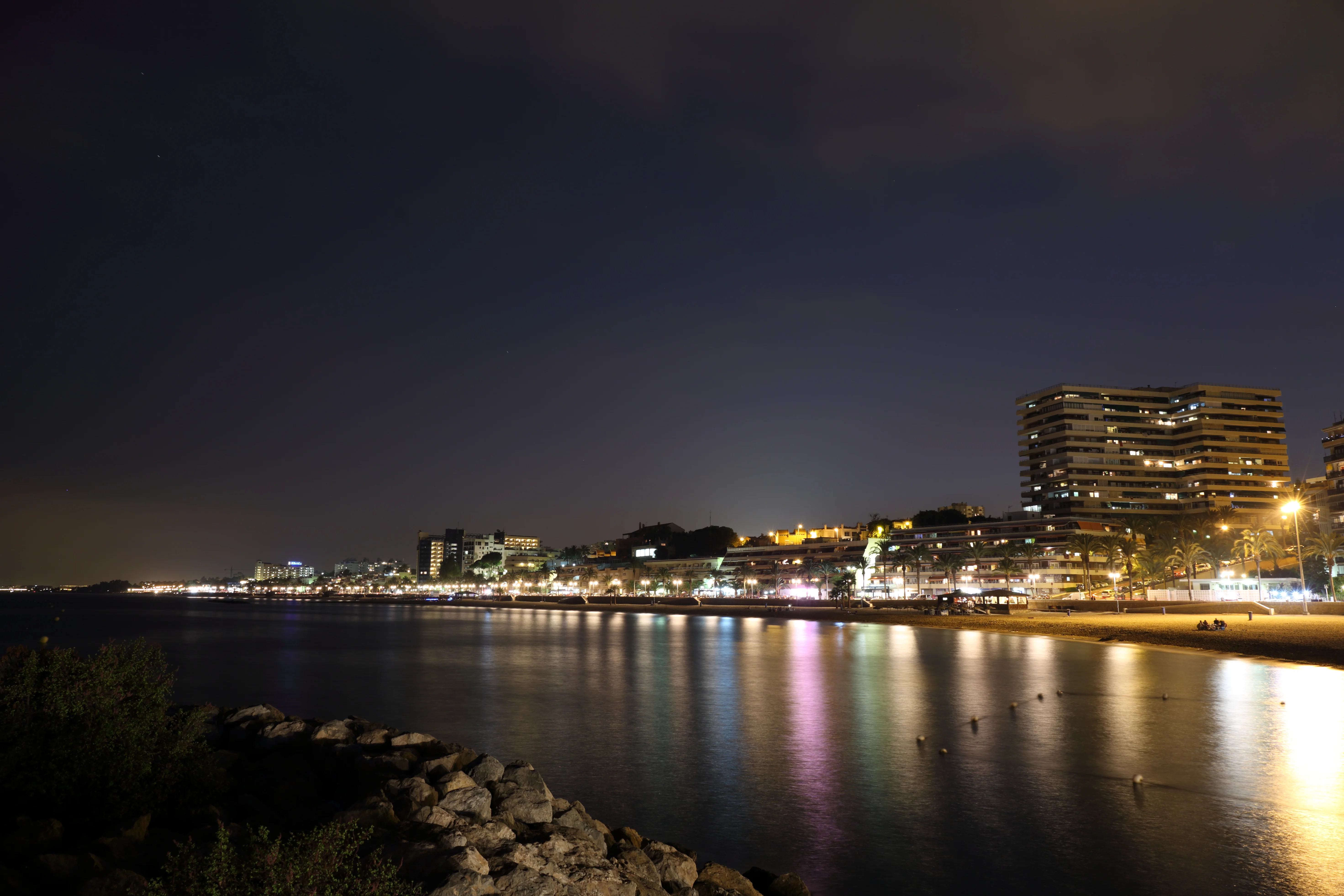 Marina nightlighting reflections at calm seawater
